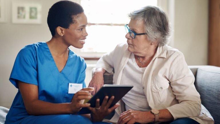 Professional live-in care Westminster carer assisting elderly person at home in comfortable living room