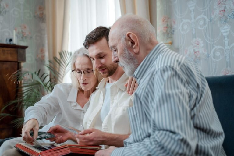 Dementia care at home: family looking through a photo album together