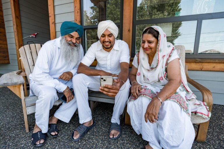 Caring for an elderly parent from a distance, with a family member checking in by video call