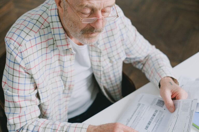 self-employed carer tax paperwork organised at a kitchen table