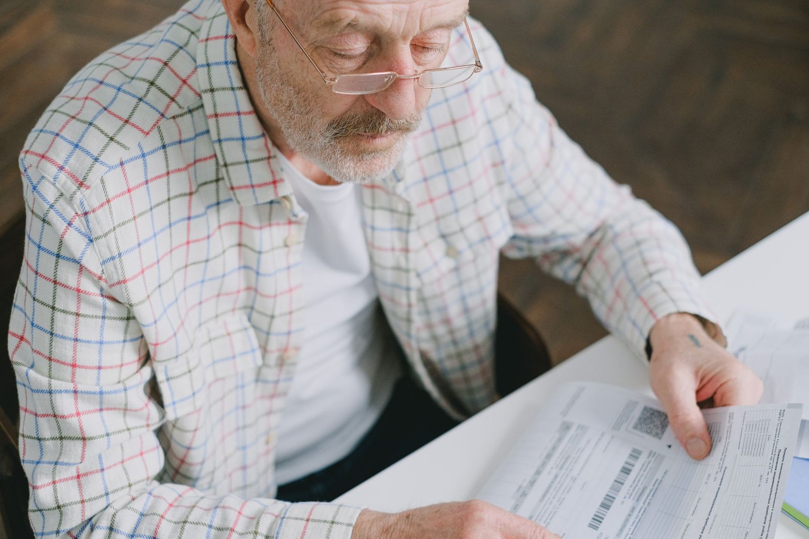 self-employed carer tax paperwork organised at a kitchen table